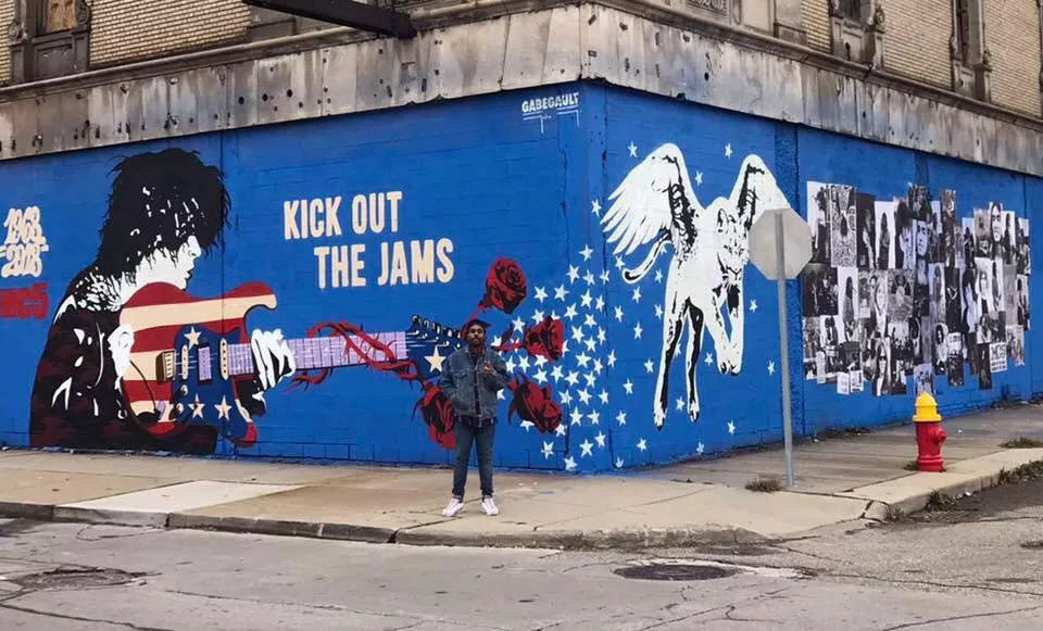 Artist Gabe Gault painted an MC5 mural at the Grande Ballroom. - ZAK WARMANN