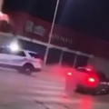 Dodge Charger does doughnuts around Detroit police car in viral video