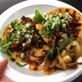 Tacos al pastor at El Parian taco truck in Southwest Detroit. Tacos al pastor at El Parian taco truck in Southwest Detroit.