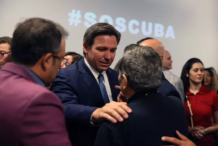 Florida Gov. Ron DeSantis greets people after holding a roundtable discussion about the uprising in Cuba at the American Museum of the Cuba Diaspora on July 13, 2021, in Miami. - PHOTO BY JOE RAEDLE/GETTY IMAGES