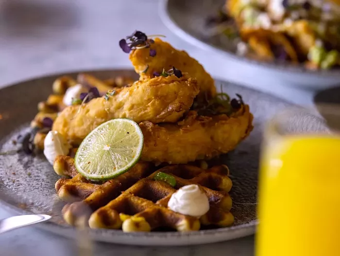 Maia House's brunch offers a savory take on the traditional chicken and waffles. - PHOTO COURTESY OF MAIA HOUSE
