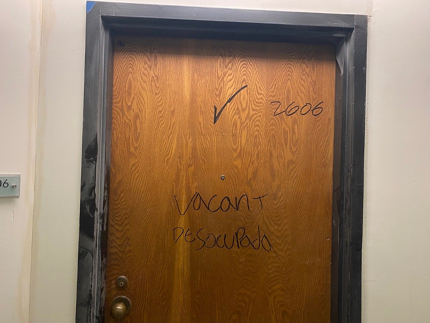 The words “Vacant” and “Desocupada” have been scribbled on doors in black marker. - PHOTO BY JESS SWANSON