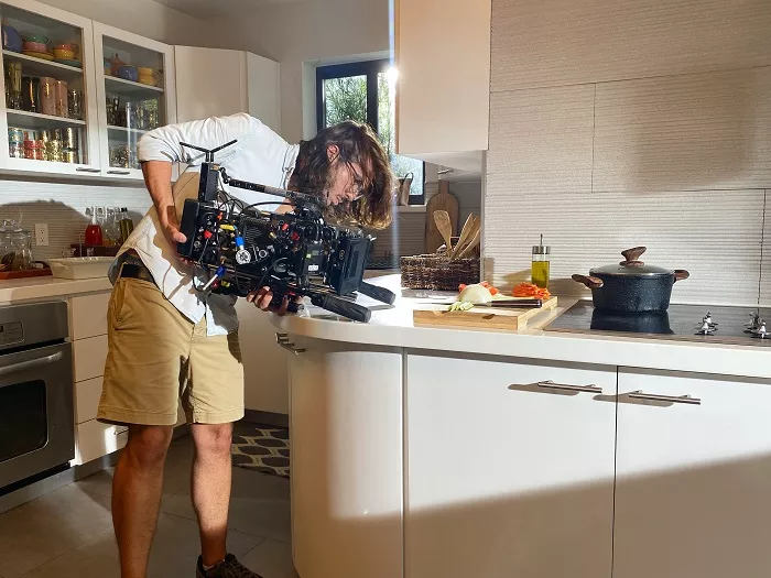 Filmmaker Oscar Ernesto Ortega in the middle of shooting. He and Betancourt had founded a film production company in Cuba before moving it to the United States. - PHOTO COURTESY OF JOSE ROVIRA