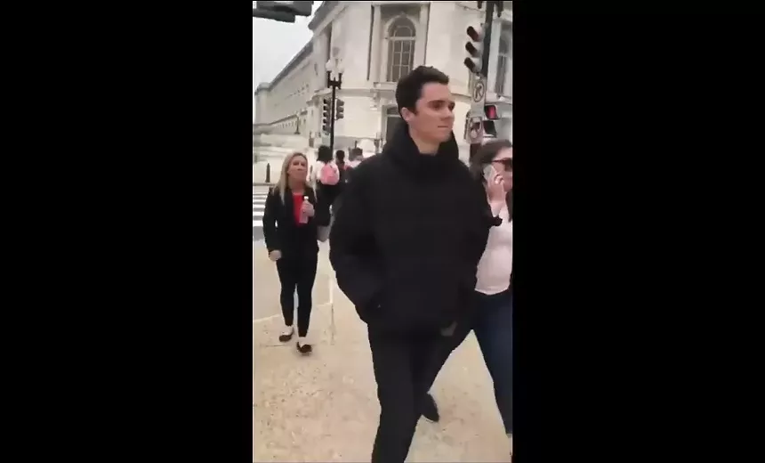 Marjorie Taylor Greene trails Parkland survivor and activist David Hogg in Washington, D.C., in 2018. - SCREENSHOT VIA @FREDGUTTENBERG/TWITTER
