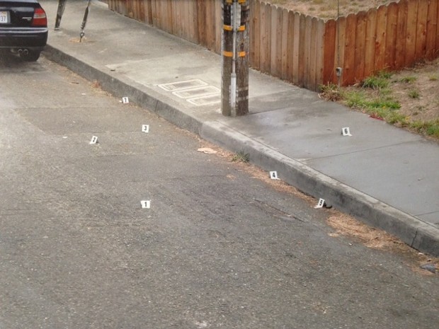 A police photo of the scene of the fatal shooting. Numbered white evidence markers show the locations of where California Department of Justice investigators found seven shell casings from officer Stephan Linfoot's gun. - THADEUS GREENSON