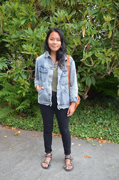 Art student and Palmdale native Christine is taking Native American studies and thrifting hard — her shirt and bag are thrift and free-pile finds, but the denim jacket is her boyfriend's. - PHOTO BY SHARON RUCHTE