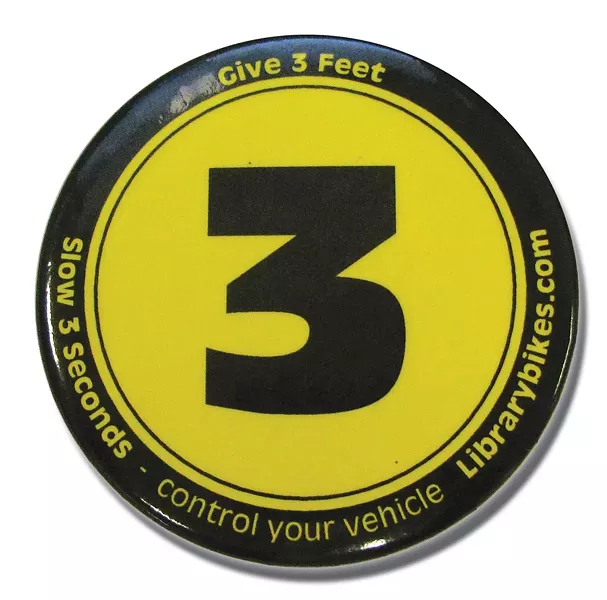 Button promoting three feet for safety - PHOTO BY HOLLY HARVEY