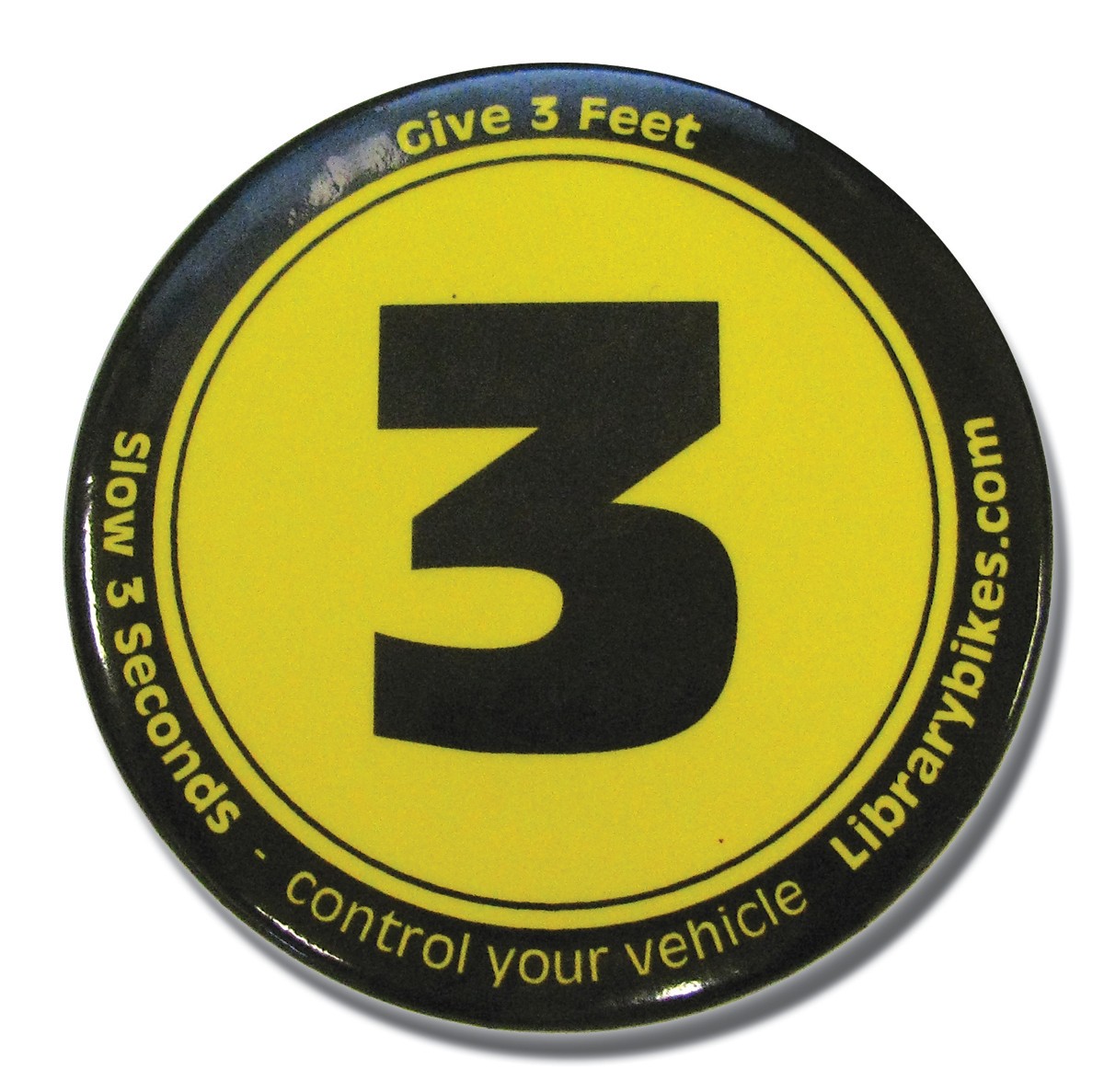 Button promoting three feet for safety - PHOTO BY HOLLY HARVEY