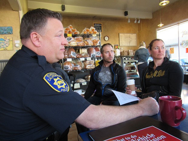 Capt. Steve Watson sits with Todd and Tanya Hudy at Vellutini Bakery. - LINDA STANSBERRY