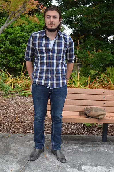 Frenchman Thomas is taking African studies and blending into his new environment with a plaid shirt, jeans and classic black boots. - PHOTO BY SHARON RUCHTE
