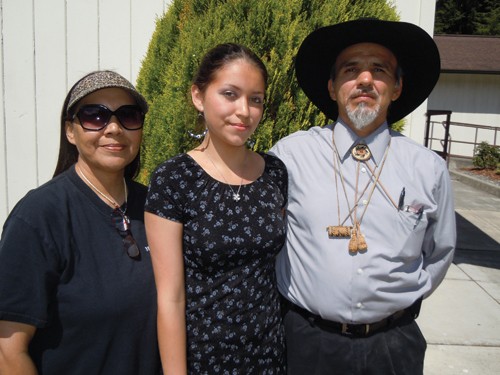 Gayle Norris, left; her daughter Jamyelynn, 19, a traditional dancer; and Yurok Tribe Chairman Thomas O'Rourke Sr. at the ceremony to welcome back ceremonial items. - PHOTO BY HEIDI WALTERS