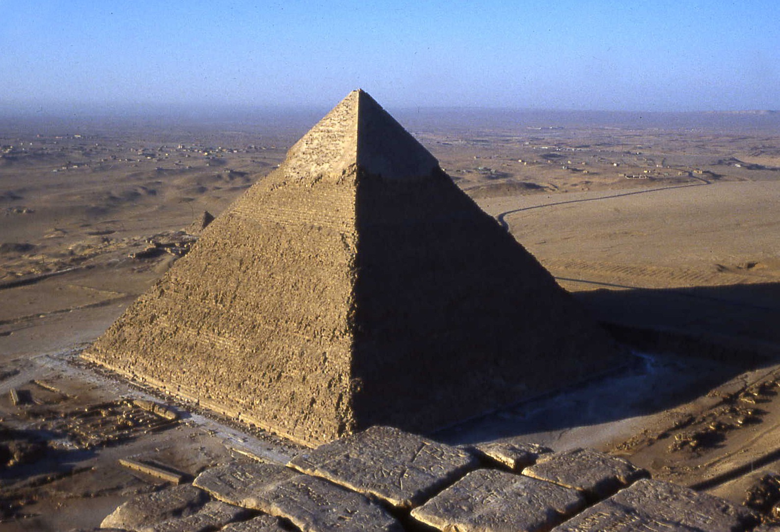 Giza, Egypt: looking southwest from the top of the Great Pyramid of Cheops/Khufu, now 455 feet high, toward that of his son Khafre. The Great Pyramid was the tallest structure in the world for nearly 4,000 years. - PHOTO BY BARRY EVANS