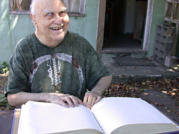 Harvey Jossem, summer 2006, opens his braille dictionary at random. "'Salient!'" He says. It was as if the dictionary &mdash; voluminous, supposedly obsolete — had chosen that word to be discovered that day. To make a point.  Photo by Heidi Walters