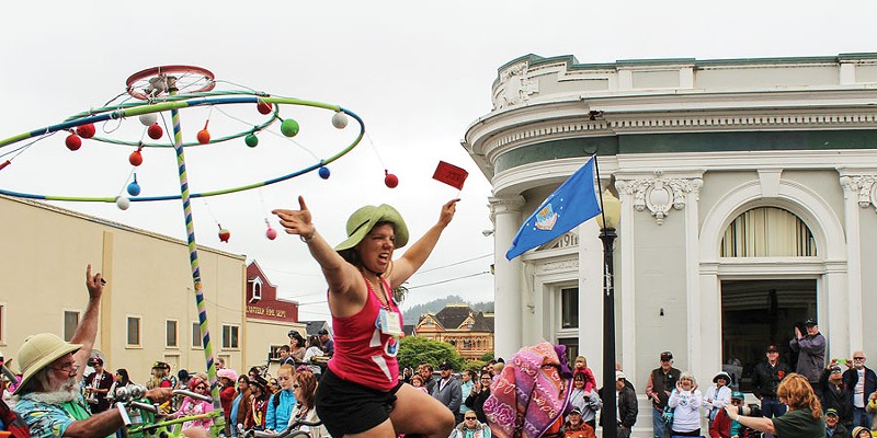 Jerri Wagner joyously crosses the finish line of the 46th annual Kinetic Grand Championship on the rolling, spinning sculpture "Up!" The 42-mile Memorial Day weekend trek concluded on Ferndale's Main Street on Monday, May 27.