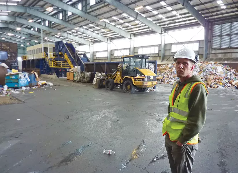 Mike Seeber, Arcata Community Recycling Center’s operations director, surveys the insides of the agency’s state-of-the-art Samoa processing facility. - PHOTO BY RYAN BURNS