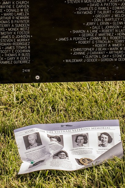Navy veteran Spencer T. "Ernie" Earnshaw, 71, of Loleta, said he found this token dedicated to the women who volunteered to go to Vietnam, and decided to place it at the Wall memorial with a handout with photos and descriptions of the eight women whose names are on the Wall.  He placed both just under the name of Sharon Ann Lane who was killed in 1969. The token reads, "Tribute to women veterans," "She chose to serve" - MARK LARSON