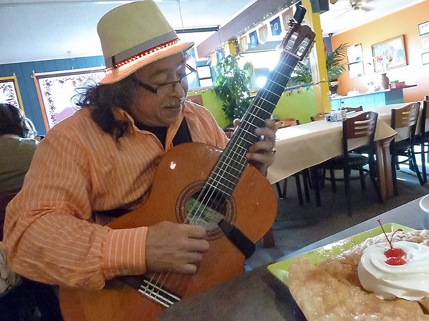 Nicaragua-born guitarist Angel Fargas plays for diners at Carmela's Mexican Restaurant in McKinleyville every Friday evening. - PHOTO BY BOB DORAN