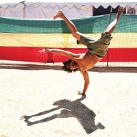 Reckless Rex Atlenza, leader of the break dance crew Humboldt Rockers, breaks a move backstage at Reggae on the River Sunday afternoon, Aug. 3.