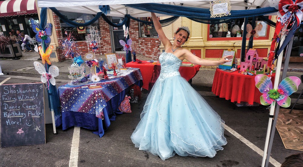 Shoshanna of Redwood Raks CASTS free pixie dust spells in her booth at the Arcata Chamber of Commerce's Fourth of July Jubilee celebration on the plaza. - PHOTO BY BOB DORAN