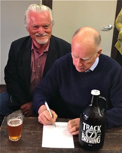 Assemblymember Wesley Chesbro grinnin' like a fool at Track Seven Brewing Co. in Sacramento while Gov. Jerry Brown signs his growler bill, AB 647. - PHOTO COURTESY WES CHESBRO'S OFFICE
