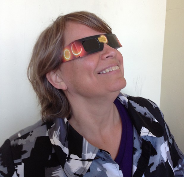 The Arcata Playhouse's Jackie Dandeneau wearing special eclipse viewing glasses - PHOTO BY BOB DORAN