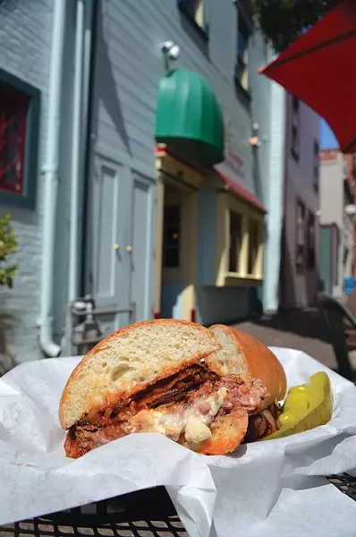 The Blue Noon burger, al fresco, at Café Nooner. - PHOTO BY JENNIFER FUMIKO CAHILL