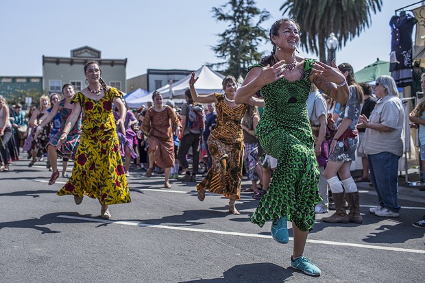The first dancers of the parade make their way down Ninth Street at the North County Fair. - ALEXANDER WOODARD