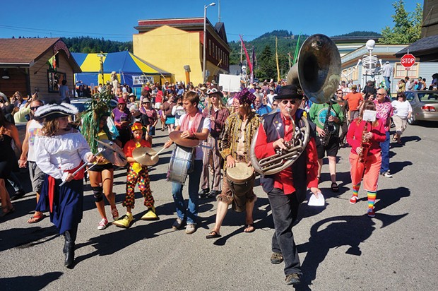 Tuba player Gregg Moore leads Bandemonium's parade though Blue Lake as the town declares itself "Center of the Universe" on Sunday, June 29. - PHOTO BY BOB DORAN