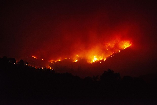 Fire burns the hills north of Upper Lake on Tuesday night. - MARK MCKENNA