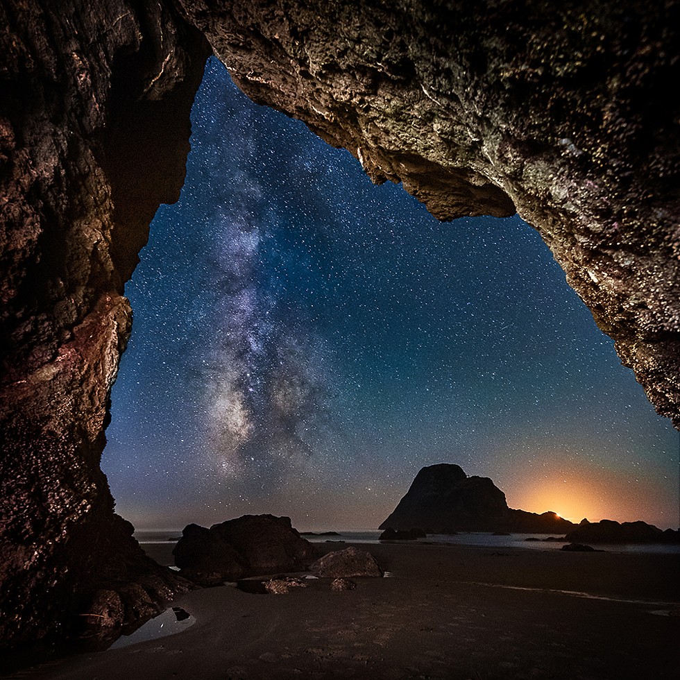The Milky Way rises from the Pacific near the glow of the setting crescent moon outside of this hidden cave near Camel Rock. Sept. 13, 2018. - PHOTO B Y DAVID WILSON