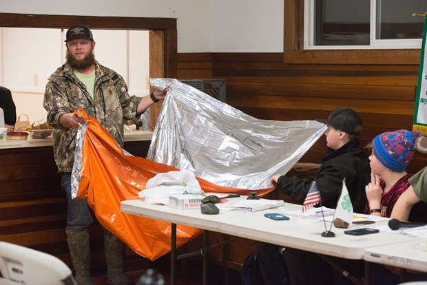 Justin Lehnert holds up a survival blanket during the Miranda 4-H meeting. - MARK MCKENNA
