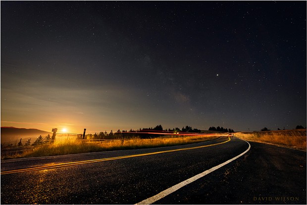 As the world turns beneath the Kneeland Road, a moon recently full rises in the southeast to chase the Milky Way across the night sky. Humboldt County, California. July 18, 2019. - DAVID WILSON