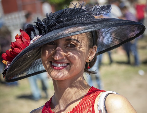 Laura Ayllon, of Loleta, put her sun hat to good use on the sunny afternoon. She placed second in the Most Glamorous category. - PHOTO BY MARK LARSON