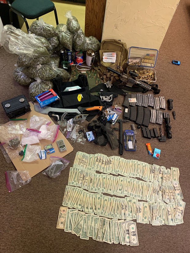 Drug, guns and money found in the vehicle. - HCSO