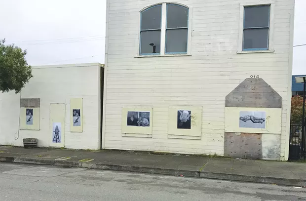 The wheatpasted black and white copies of Weidel's original Heroin Hilton images. - PHOTO BY JESSE WIEDEL