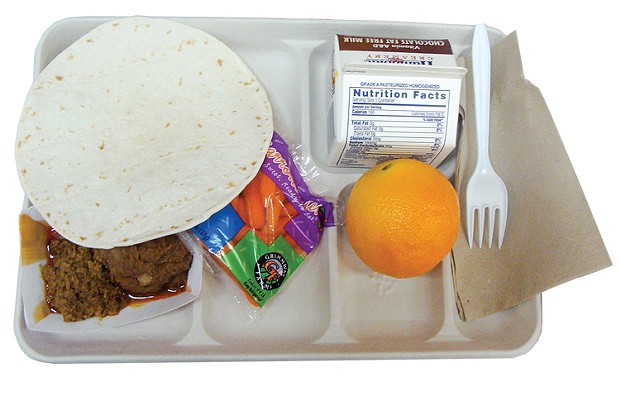Schools have ditched the lunch trays and turned to brown bags amid unprecedented COVID-19 shutdowns in an effort to keep children fed while schools are shuttered. - FILE