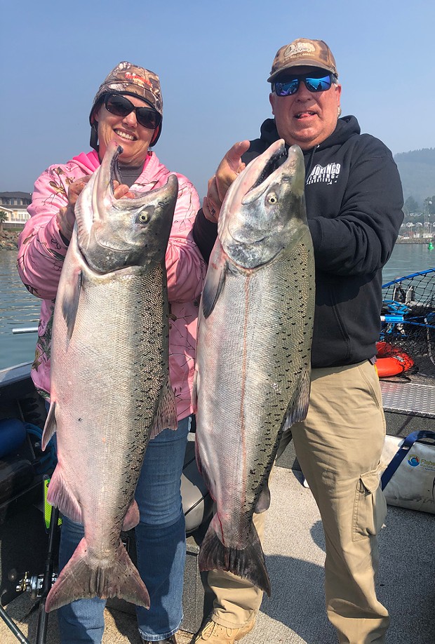 Mellisa and Ed Brusven of Fallon, Nevada, hold a pair of 30-plus-pound king salmon caught Oct. 1 at the mouth of the Chetco River while fishing with guide Andy Martin of Wild Rivers Fishing. - COURTESY OF WILD RIVERS FISHING