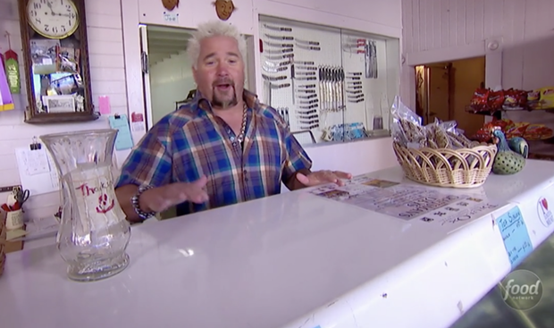 Fieri behind the counter at the Ferndale Meat Co. on his show Diners, Drive-ins and Dives. - FOODNETWORK.COM