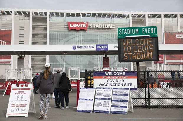 Patients enter Levi’s Stadium to receive Pfizer COVID-19 vaccines on Feb. 9 2021 in Santa Clara. - PHOTO BY ANNE WERNIKOFF, CALMATTERS