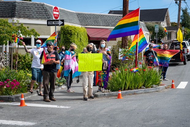 About a dozen people came out to fight hate on the corner of H and 18th streets in Arcata on Friday after posts on Nextdoor and social media told of a Pride Flag that was displayed in a garden on the same corner had been burned. - MARK MCKENNA