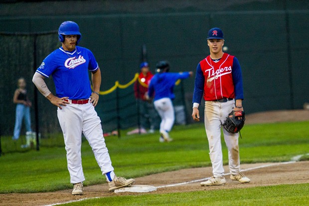 Crabs designated hitter and local Aidan Morris (#39) stands next to younger brother Keenan Morris playing third base for the Redding Tigers at Arcata Ballpark on June 23, 2021. - THOMAS LAL