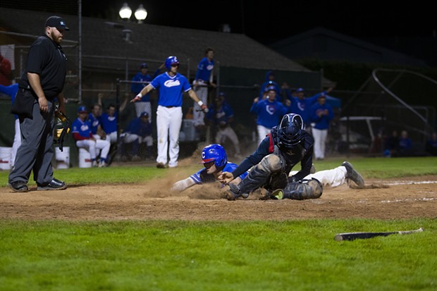 Crabs designated hitter Ethan Smith slides into home to tie the game in the bottom of the 10th inning while the Crabs take on the Redding Tigers at Arcata Ballpark on July 20, 2021 after the team gave up a six run lead in the top of the ninth inning. - THOMAS LAL
