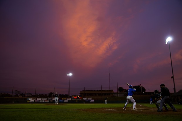 Crabs outfielder Josh Lauck stands in the batter's box as the sun sets over Arcata Ballpark on July 27, 2021. - THOMAS LAL