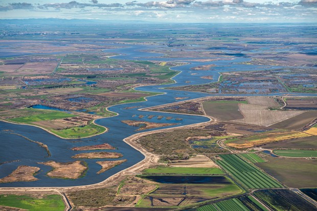 Aerial view looking north along Middle River left of the river is Mandeville Island and on the right is McDonald Island, both part of the Sacramento-San Joaquin River Delta in San Joaquin County, California. Photo taken March 08, 2019. - KEN JAMES / CALIFORNIA DEPARTMENT OF WATER RESOURCES