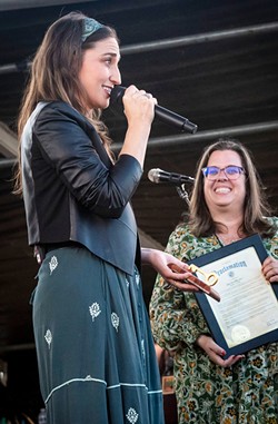 Eureka Mayor Susan Seaman presents Sara Bareilles with a key to the city made by local craftsman Eric Hollenbeck after reading a proclamation designating  Oct. 16, 2022, as Sara Bareilles Day in the city. - PHOTO BY MARK A. LARSON