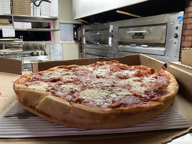 A deep-dish Chicago pizza straight from the oven at Brett's Pizzeria. - PHOTO BY JENNIFER FUMIKO CAHILL