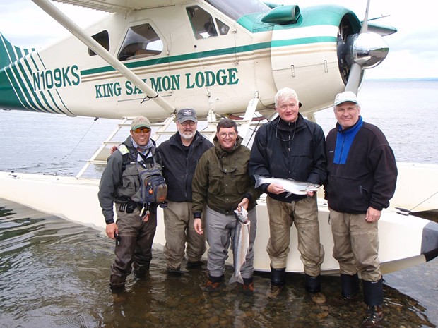 Leonard Leo, center, on the 2008 fishing trip with a guide and other guests. Leo attended and helped organize the Alaska fishing vacation. - PHOTO OBTAINED BY PROPUBLICA
