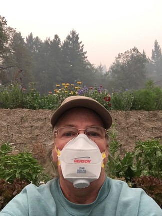 Dottie Simmons of Simmons Natural Bodycare wears a specialty protective mask to garden at her home in Dinsmore. - DOTTIE SIMMONS