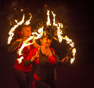Circus of the Elements performers Loreta Flemingaite (left), of McKinleyville, and Chakeeta Marie Garabedian, of Trinidad, fire-dancing at Elemental: An Outdoor Pageant Spectacle. - MARK LARSON