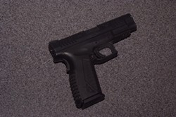 The .45 caliber handgun that O'Quinn allegedly shot a CHP officer with. - EPD